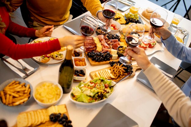 Young father having breakfast with his son and daughter at home, closeup on the food