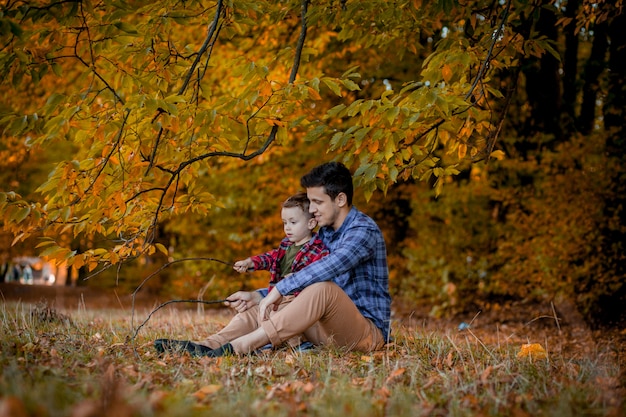 Young father and his little son enjoy outdoors in a park