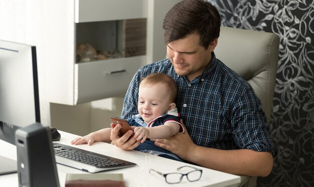 Young father is talking care of his toddler