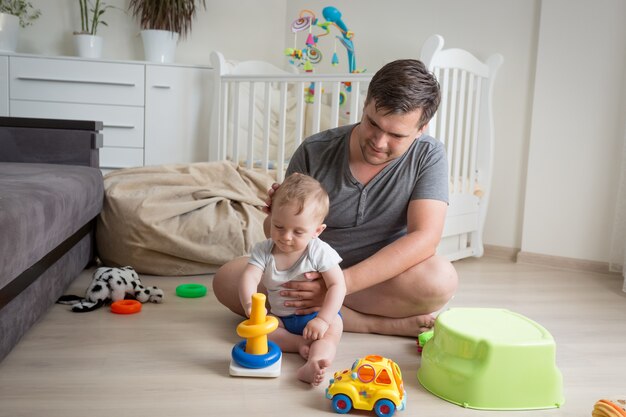 young father is talking care of his toddler