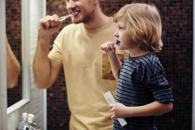 young father with son shaving