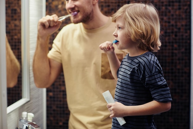 Young Father with Son Shaving