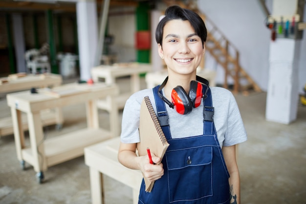 Young Fe,ale Worker Posing at Factory