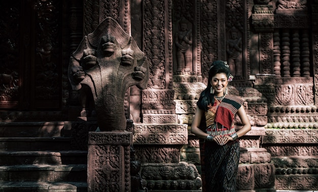 Young female Actress wearing beautiful ancient costumes, in ancient monuments, dramatic style. Perform on legend love popular story, Thai Isan folktale called "Phadaeng and Nang-ai" in acient site