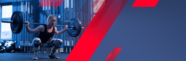 young female athlete training in gym, doing strength exercises, practicing. beautiful girl works on her upper and lower body. fitness, wellness, sport, healthy lifestyle concept. flyer with copyspace.