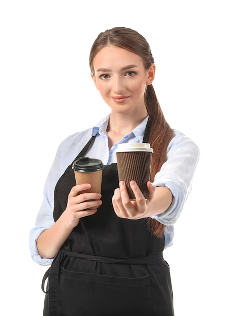 Young female barista on white background