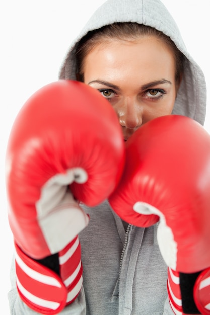 Young female boxer with hoodie on