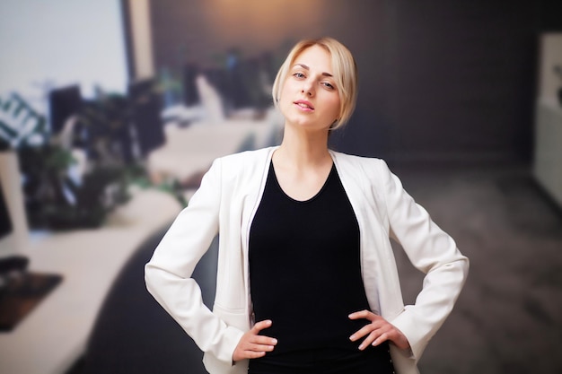 Young female businesswoman working in her office