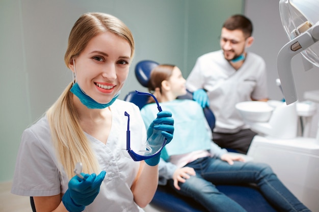 Young female dentist smiling at the clinic