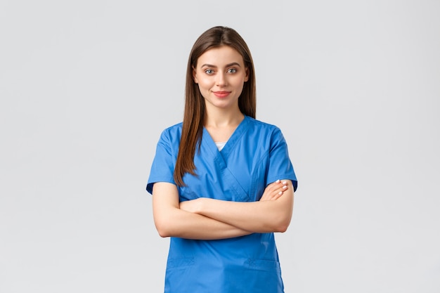 Young female doctor in blue uniform