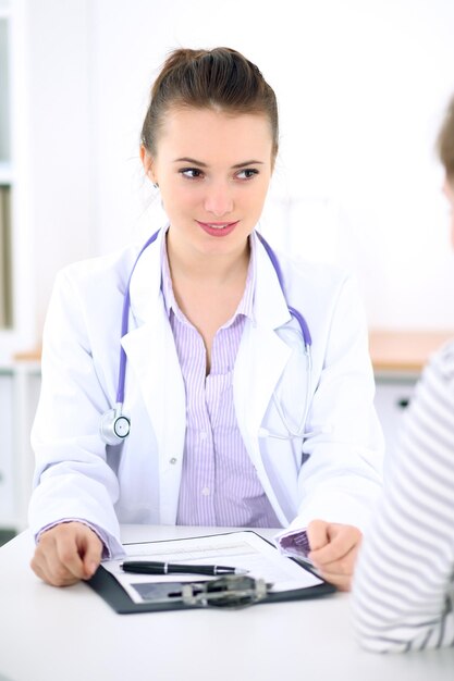 Young female doctor listen to patient story carefully. Medical  and Health care concept.