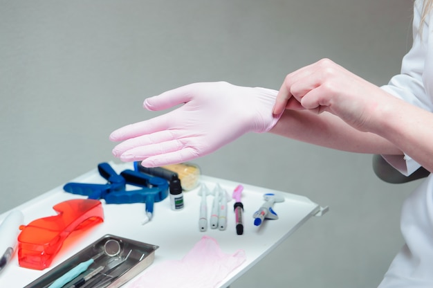 A young female doctor preparing herself for working