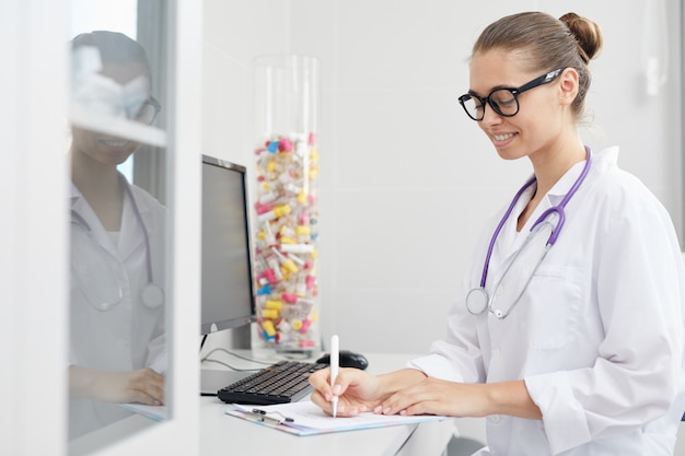 Young Female Doctor at Workplace