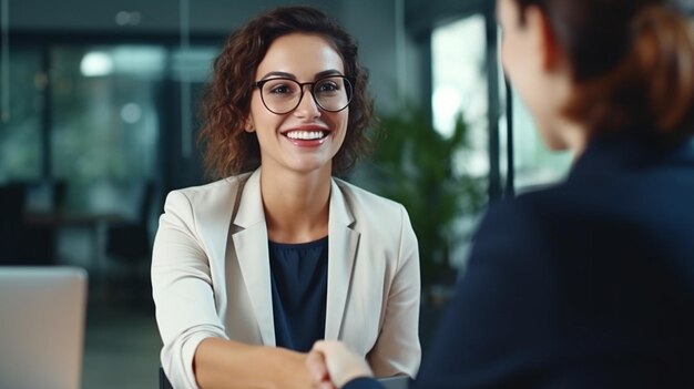 young female employee in formal office wear with colleague