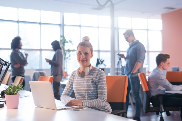 Young female Entrepreneur Freelancer Working Using A Laptop In Coworking space