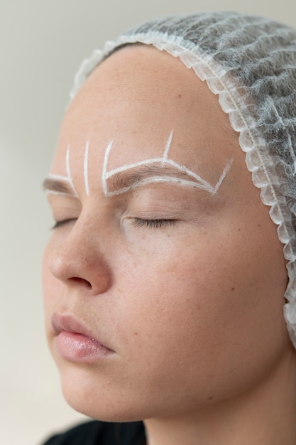 Young female going through a microblading procedure