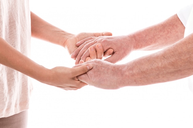 Young female hands and old male hands