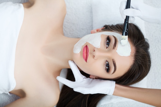 Young female lying in spa salon after procedure of body massage