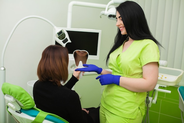 Young female patient visiting dentist office