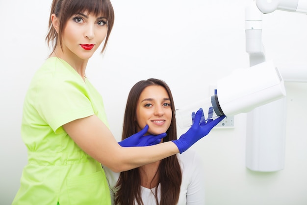 Young female patient visiting dentist office