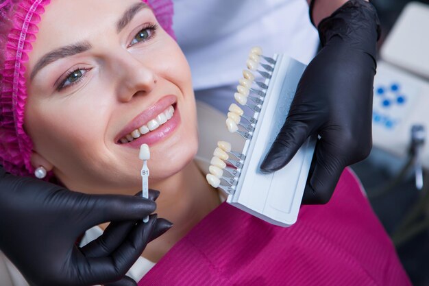 Photo young female patient with pretty smile examining dental inspection at dentist clinic healthy teeth