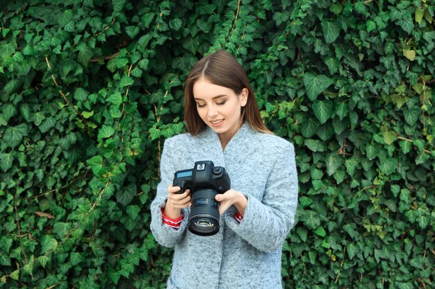 Young female photographer outdoors