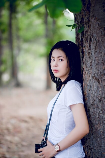 Young female photographer in the park