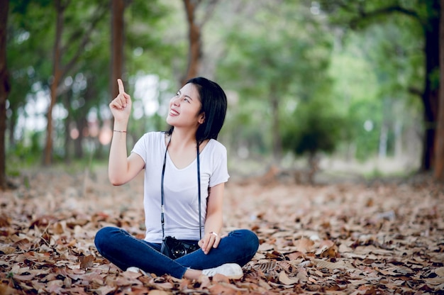 Young female photographer in the park