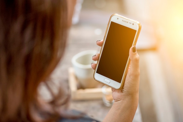  Young female Playing Video Game On Mobile