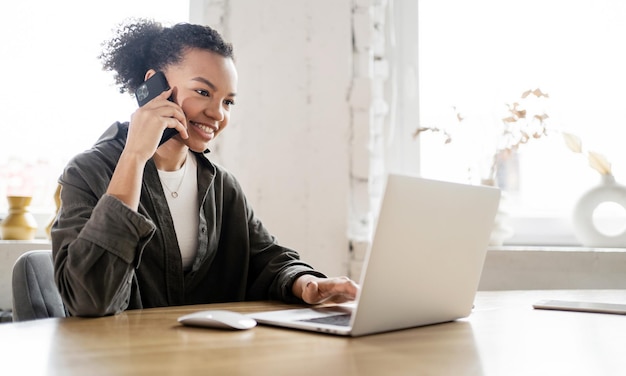 A young female secretary works in an office Uses a laptop online report