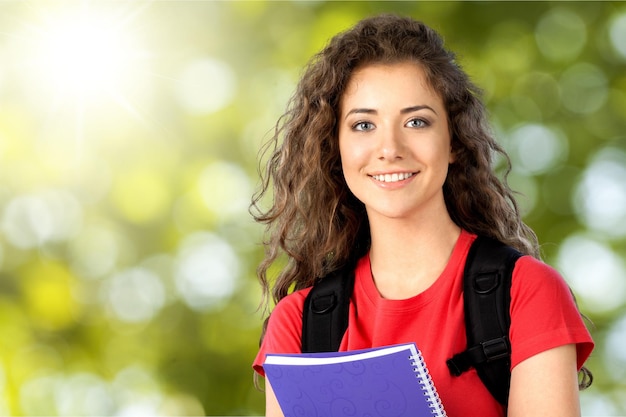 Photo young female student on background