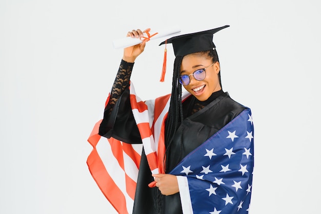 Young female student in robe celebrating her graduation