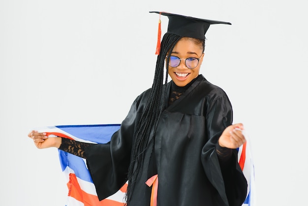 Young female student in robe celebrating her graduation