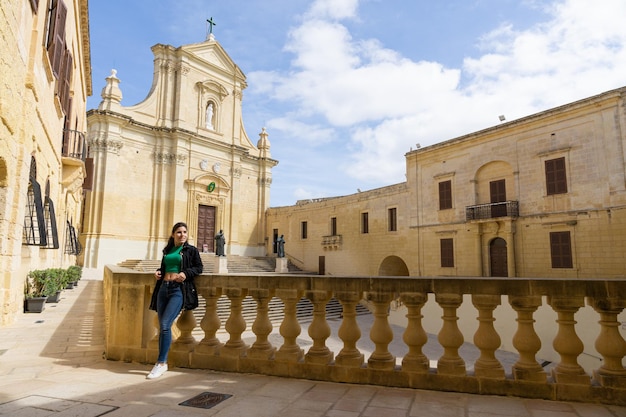 Young female tourist visiting the Citadel in Gozo in Malta