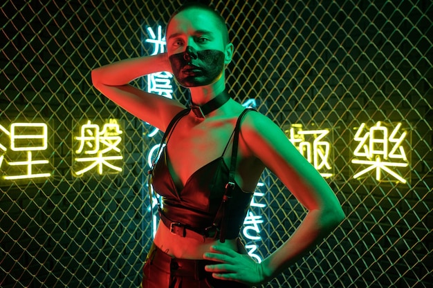 Young female with very short hair posing in front of camera