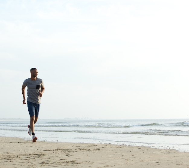 Young fit african american man running 