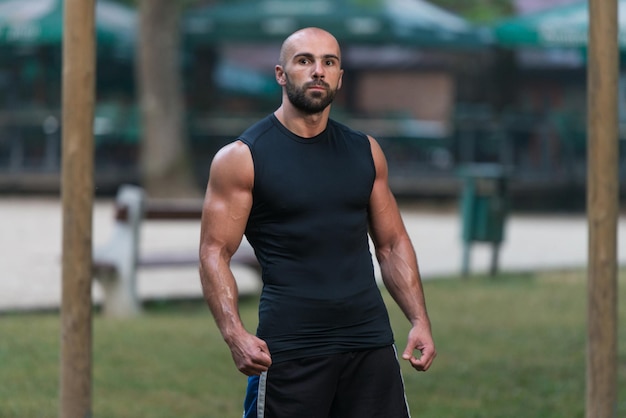 Young Fit Handsome Adult Man Posing Outdoors In Nature