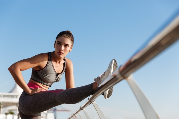 Young fit sportswoman working out