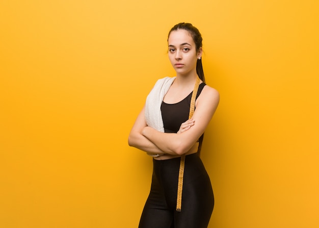 Young fitness girl looking straight ahead