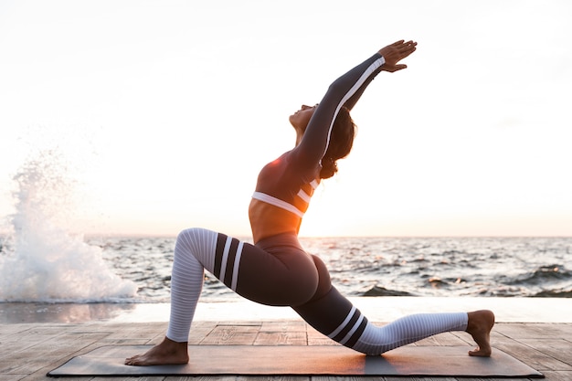 Young fitness lady stretching