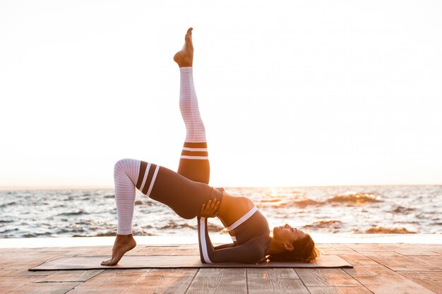 Young fitness lady stretching