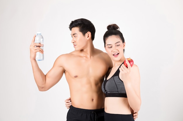 Young fitness  man and his girlfriend in training gym .