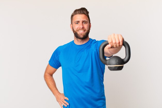 Young fitness man lifting a dumbbell