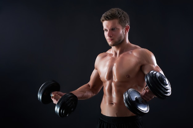 Young fitness man in studio