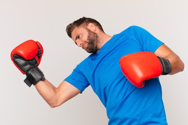 Young fitness man with a boxing gloves