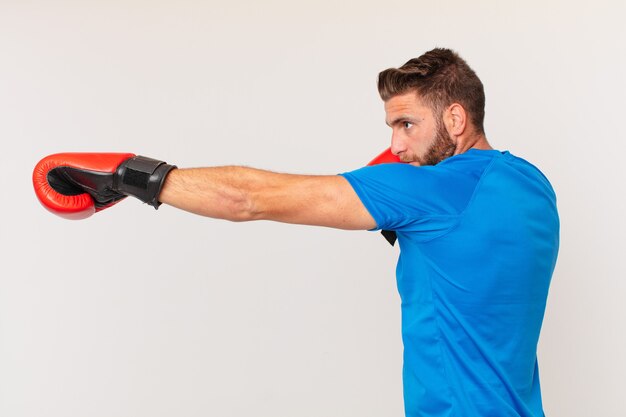 Young fitness man with a boxing gloves