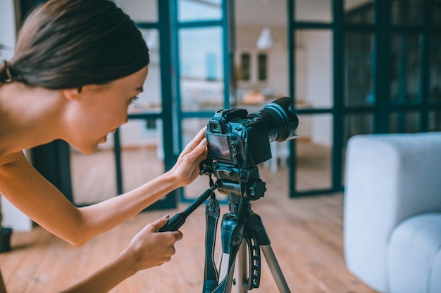 Young fitness vlogger recording a video