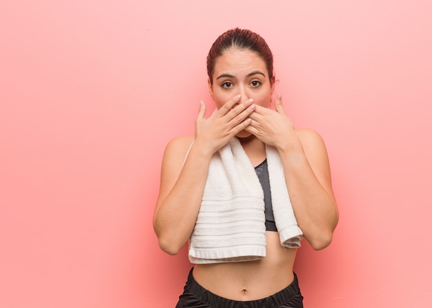 Young fitness woman surprised and shocked