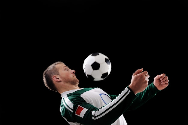 Young football player with ball