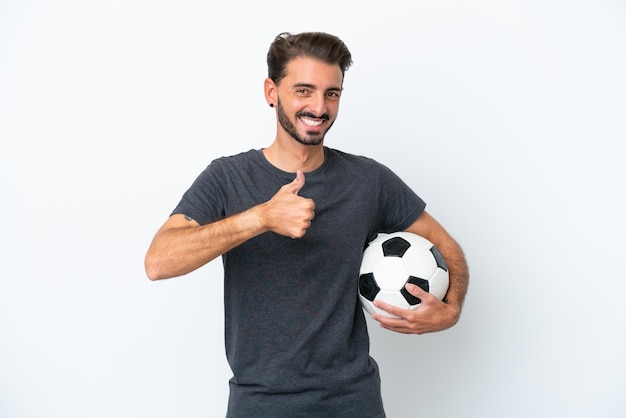 Young football player woman isolated on white background giving a thumbs up gesture